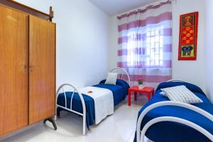 Ліжко або ліжка в номері Appartamento Orchidea B2 - MyHo Casa