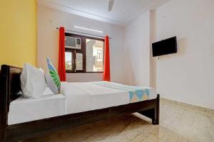 Posteľ alebo postele v izbe v ubytovaní Flagship Sp Residency