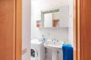 Ванна кімната в Appartamento Orchidea B2 - MyHo Casa