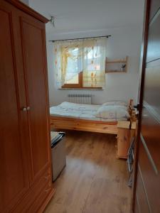 Posteľ alebo postele v izbe v ubytovaní Pokoje Goscinne TOMASZ