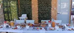 a white table with food on top of it at Villa Nefeli Ksamil in Ksamil