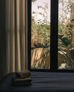 a towel sitting on a table in front of a window at The Kozyhome in Ouarzazate