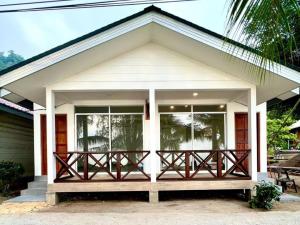 a small house with a porch at Dumba Bay Tioman in Tioman Island