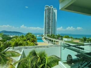 a view of a building from the balcony of a building at Southbay Seaview Condo A10 #10minQueensbay #15minSPICE in Bayan Lepas