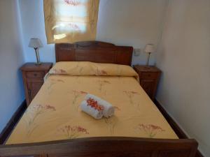 a small bedroom with a bed with two night stands at Gran Hotel Concordia in Salto