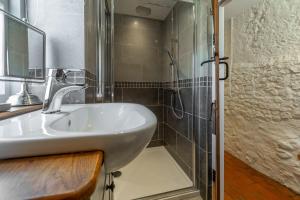 a bathroom with a sink and a shower at The Old Chapel W in Little Walsingham