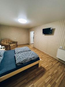 Llit o llits en una habitació de Standart-Однокімнатна квартира біля басейну