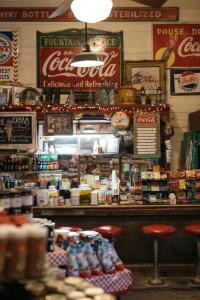 a coca cola shop with a counter and a bar at Gruene River Inn in New Braunfels