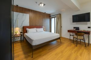 Postel nebo postele na pokoji v ubytování RoccaRegina Hotel