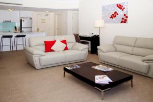 a living room with a couch and a coffee table at Toowoomba Central Plaza Apartment Hotel Official in Toowoomba +55 photos