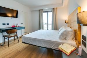 Postel nebo postele na pokoji v ubytování RoccaRegina Hotel
