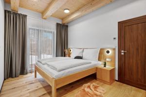 Postel nebo postele na pokoji v ubytování Apartmány Čistá
