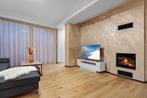 TV a/nebo společenská místnost v ubytování Apartmány Čistá