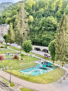 an aerial view of a park with a swimming pool at Cocon Montagnard in Eaux-Bonnes