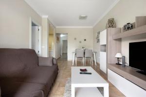 a living room with a couch and a table at Casa Fran in Puerto de la Cruz