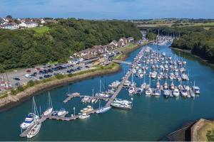 an aerial view of a marina with boats in the water at Pretty Neyland Cottage central to all attractions in Milford Haven