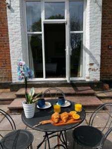 a table with a plate of food on it at No.1 Beechcroft in Liverpool