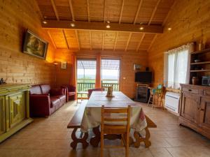 a living room with a table and a couch at Charmante maison avec piscine privée, climatisation, WiFi et parking - FR-1-616-166 in Montagnac-dʼAuberoche