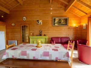 a dining room with a table and a couch at Charmante maison avec piscine privée, climatisation, WiFi et parking - FR-1-616-166 in Montagnac-dʼAuberoche +20 photos