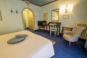 Postel nebo postele na pokoji v ubytování Hotel Boccaccio