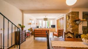 a living room with a table and a dining room at Leiras de Candoz Douro Valley in Marco de Canaveses