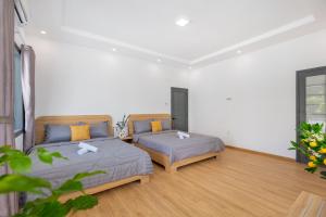 Cama ou camas em um quarto em Bliss villa (1 Phan Đình Phùng)