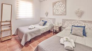Posteľ alebo postele v izbe v ubytovaní Villa Lola 14 Chiclana de la Frontera by Ruralidays