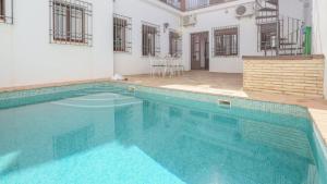 a large swimming pool in the middle of a house at Casa Leal La Puebla de Los Infantes by Ruralidays in La Puebla de los Infantes