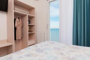 Katil atau katil-katil dalam bilik di Hotel Approdo di Venere