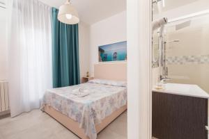 Katil atau katil-katil dalam bilik di Hotel Approdo di Venere