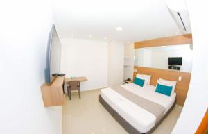 Voodi või voodid majutusasutuse Infinity Hotel toas