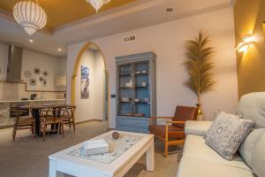 a living room with a couch and a table at Apartamentos Turísticos La Baílla in Rota