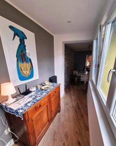 a room with a table with a guitar on the wall at Bartolo43 in Perugia +14 photos