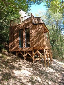a house on a wooden platform in the woods at les gites axéens (l'Ours) in Ax-les-Thermes