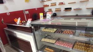 a bakery with eggs and other pastries on display at OYO Sgr Hotel in Hastināpur