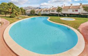 an overhead view of a large swimming pool in a yard at Atalayas De Polop Iii in Polop