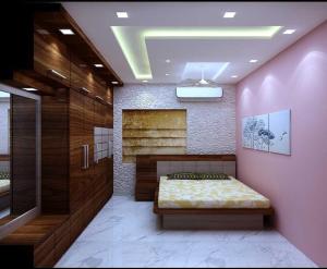 1 dormitorio con 1 cama en una pared de color rosa en Flagship Hotel Sweta Villa en Patna