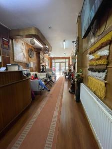 a lobby of a store with people sitting at Hotel Costa del Mar in Puerto Montt