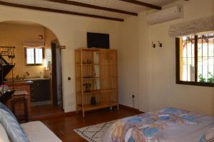 Un pat sau paturi într-o cameră la Cortijo Petra