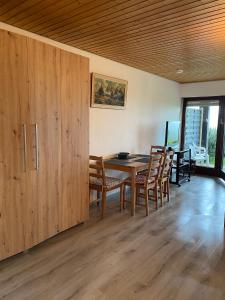 a dining room with a table and chairs at View from the Rock in Sasbachwalden