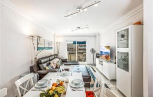 a living room with a table and a couch at 1 Bedroom Cozy Apartment In Marbella in Marbella