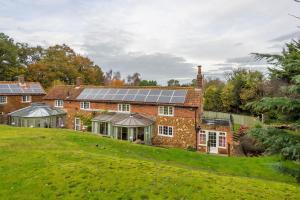 an image of a house with solar panels on the roof at Cheney Hollow in Heacham