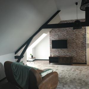 TV a/nebo společenská místnost v ubytování le Ricordeau