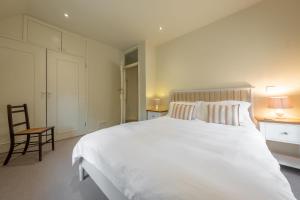 Voodi või voodid majutusasutuse Sutton Cottage toas