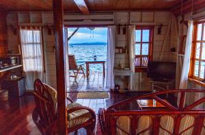 a living room with a view of the ocean at Casa Acuario Boutique Hotel in Bocas del Toro