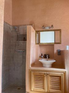 a bathroom with a sink and a shower at AdaZen Ecolodge in Azilal