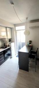 a kitchen with a table and chairs in a room at City center 2bedroom apartment in Zagreb