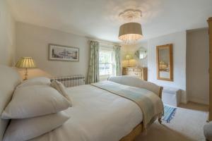 Postel nebo postele na pokoji v ubytování Burnham Cottage