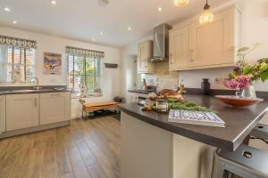 Kuchyň nebo kuchyňský kout v ubytování Driftwood Cottage + 22 fotografií