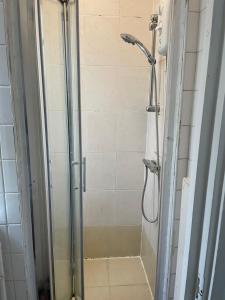 a shower in a bathroom with a glass door at 20 East Tenter Street in London